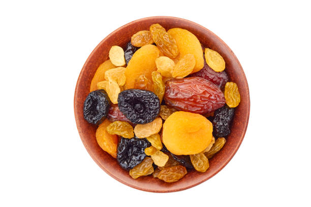Bowl of dried fruits mix isolated on white background. Top view dried-fruits